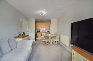 Living room opening to Kitchen- click for photo gallery